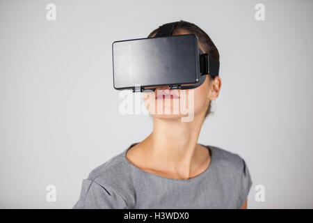 Woman using virtual reality headset Stock Photo