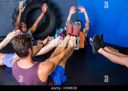 Athletes doing stretching exercise Stock Photo