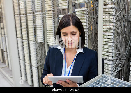 Technician using digital tablet Stock Photo