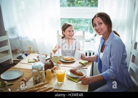 Mother and daughter having breakfast Stock Photo