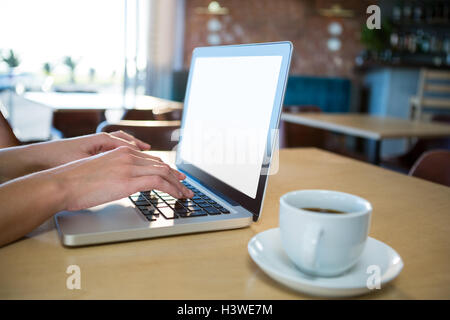 Hand using a laptop Stock Photo