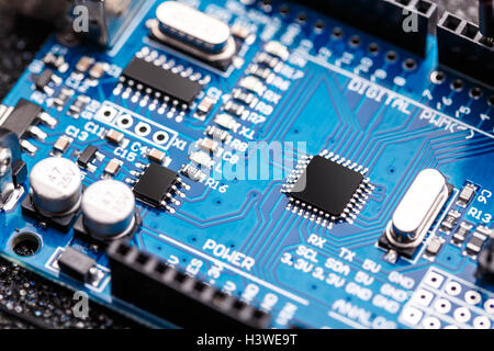 Integrated semiconductor microchip/ microprocessor on blue circuit board Stock Photo