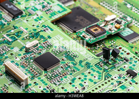 Electronic circuit,  microchip on green board Stock Photo