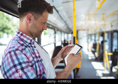 Handsome man using digital tablet Stock Photo