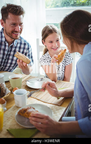 Happy family having breakfast Stock Photo