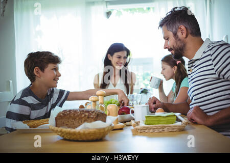 Happy family having breakfast Stock Photo