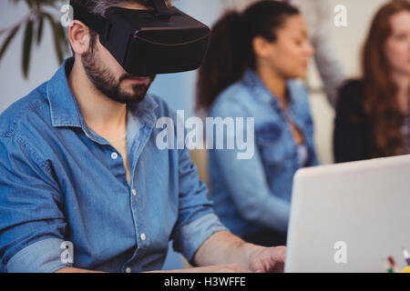 Businessman wearing virtual reality headset Stock Photo