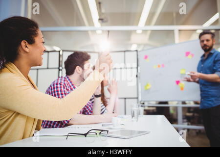 Colleagues in board room during brainstorming session at creative office Stock Photo