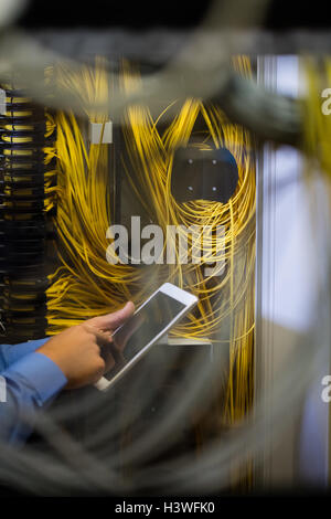 Technician using digital tablet Stock Photo