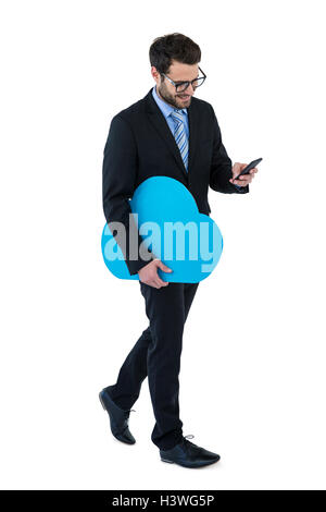 Businessman text messaging on mobile phone Stock Photo
