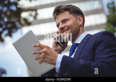 Businessman talking on mobile phone Stock Photo