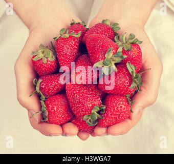 Strawberries in female hands