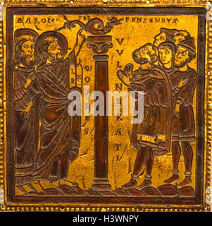 Copper plaque depicting Moses and the Brazen Serpent. Dated 12th Century Stock Photo