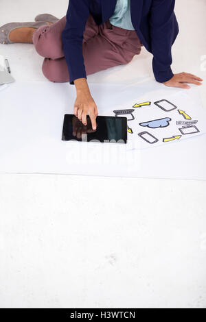 Businesswoman using digital tablet Stock Photo
