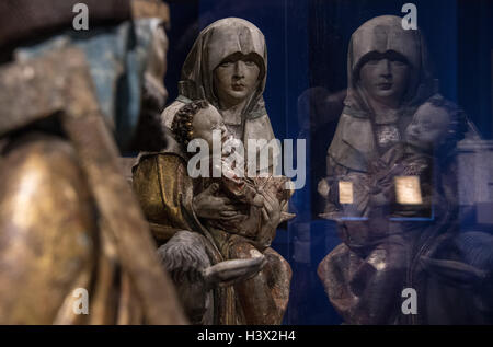 A detail of the sculpture group 'Escape to Egypt' from 1515 is reflected in the exhibition 'Holy Night - The Christmas story and its imagery' at Liebighaus in Frankfurt on the Main, Germany, 11 October 2016. The exhibition addresses the differential aspects of the Christian Christmas story. PHOTO: BORIS ROESSLER/dpa Stock Photo
