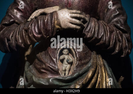 A small sculpture of the Jesus child is hidden in the hinged belly of a madonna sculpture in the exhibition 'Holy Night - The Christmas story and its imagery' at Liebighaus in Frankfurt on the Main, Germany, 11 October 2016. The exhibition addresses the differential aspects of the Christian Christmas story. PHOTO: BORIS ROESSLER/dpa Stock Photo