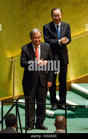 New York, USA. 13th October, 2016. Antonio Guterres (front) gestures after he was appointed as the new UN Secretary-General at the UN headquarters in New York, Oct. 13, 2016. The United Nations General Assembly on Thursday appointed by acclamation Portuguese former Prime Minister Antonio Guterres as next UN secretary-general to succeed retiring Ban Ki-moon on Jan. 1, 2017. Credit:  Li Muzi/Xinhua/Alamy Live News Stock Photo