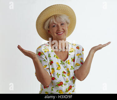 Senior, straw hat, dress, gesture, helplessly, innocently, half portrait, summer Senior, cut outs, studio, inside, outside, woman, old, summer dress, care, desperation, unsuspectingly, cluelessness, innocence, smile, Stock Photo