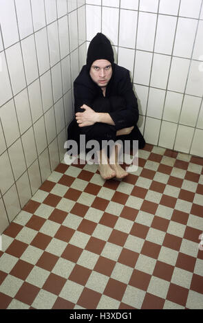 Chill house, tiled, man, suit, cap, barefoot, sit, floor, anxiously, slaughter-house, 30-40 years, sadly, loneliness, grief, worries, discouragement, exited, feebly, depressions, confusion, oppression, apathetically, disinterest, apathy, apathy, helplessn Stock Photo