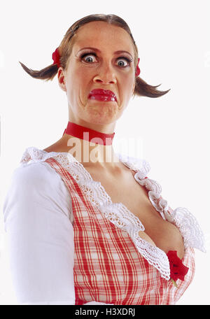 Woman, young, facial play, malicious, dirndl, Dekollete, half portrait, women, cut out, studio, maliciously, estimating, grimace, view, camera, goiter cord, plaits, Stock Photo