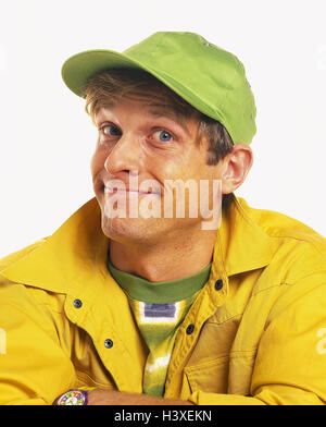 Man, sign cap, green, jacket, yellow, smile, portrait, Men, young, grin, smile, happy, cheerfully, leisurewear, brightly, studio, cut out, Stock Photo