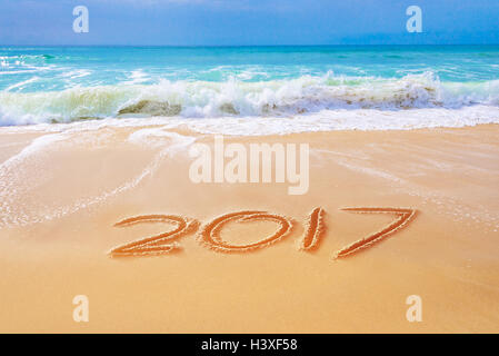 2017 written on the sand of a beach, travel 2017 new year concept Stock Photo