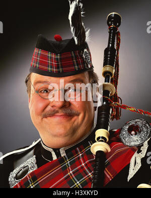 Scot, thickly, glasses, facial play, grin, portrait, concepts, Scotland, man, overweight, musical instrument, bagpipes, tradition, clothes, headgear, checked, smile, expression, happy, friendly, studio, near, Stock Photo
