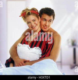 Bed, couple, young, sit, embrace, woman, pyjamas, embrace, half portrait, Couples, inside, at home, man, woman, bedroom, smile, happy, luck, satisfaction, love, affection, heat, tenderness, near, Stock Photo