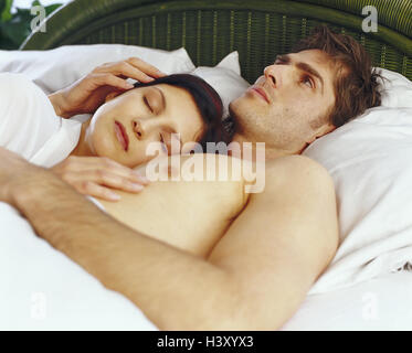 Bed, couple, portrait, inside, bedroom, young, woman, sleep, consider man, thoughtful, fall asleep, cuddle, at home Stock Photo