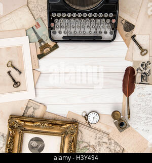 Antique typewriter and vintage office tools on wooden table. Flat lay Stock Photo