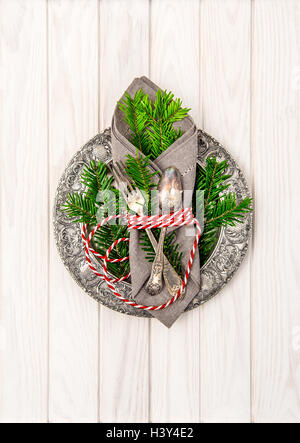 Christmas composition. Festive table place setting decoration with christmas tree brunches Stock Photo