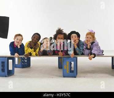 Children, nationality passed away, gesture, okay, group picture, boys, girls, nations, skin colour, differently, lie, add support head, there smile, happily, melted, OK, perfectly, in order, friends, friendship, inside, studio, copy space, Stock Photo