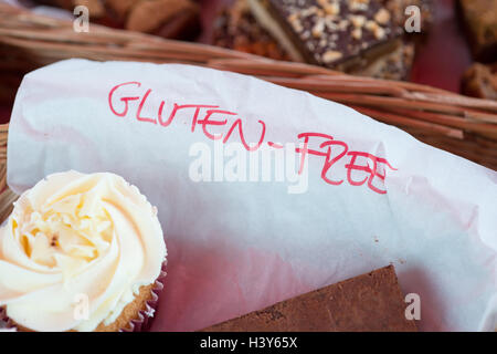 gluten free label with chocolate brownie and yellow iced cupcake Stock Photo