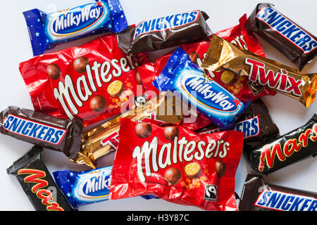 Fun Size Family Favourites, selection of  Mars, Snickers, Twix, Milky Way and Maltesers chocolate set on white background - looking down on from above Stock Photo