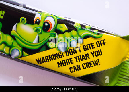 Warning don't bite off more than you can chew - detail on pack of Xtreme Chewits extremely sour apple Stock Photo