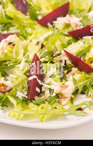 Salad with beetroot in close up. Healthy diet food with vegetables. Served on a plate as vegetarian meal or appetizer. Stock Photo