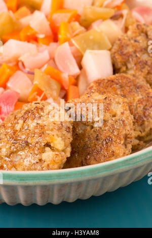 Healthy vegetarian meat free burgers on round chopping board with vegetables  and spinach on light background Stock Photo - Alamy