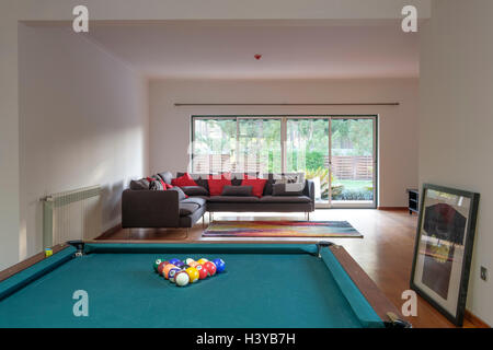 Billiards table in game room at home Stock Photo