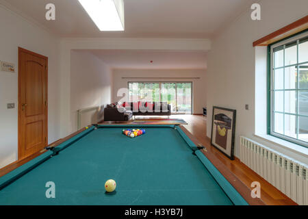 Billiards table in game room at home Stock Photo