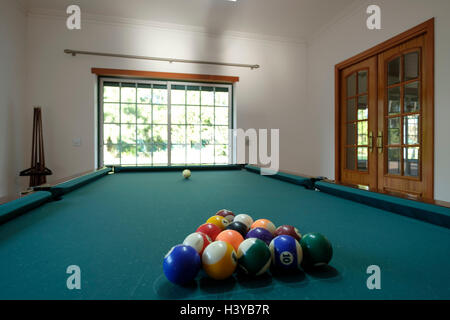 Billiards table in game room at home Stock Photo