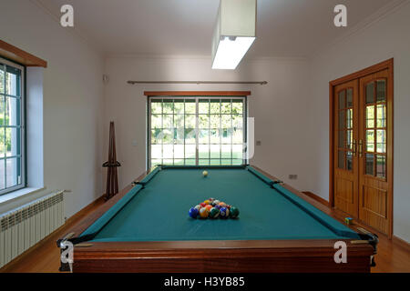 Billiards table in game room at home Stock Photo