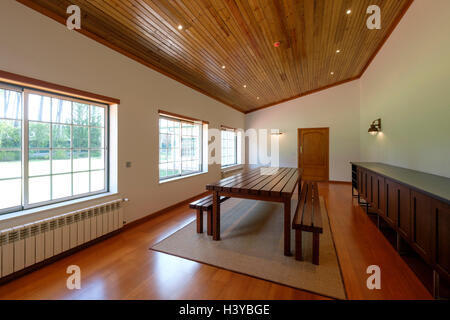 Dining room with a big wooden table Stock Photo