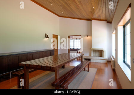 Dining room with a big wooden table Stock Photo