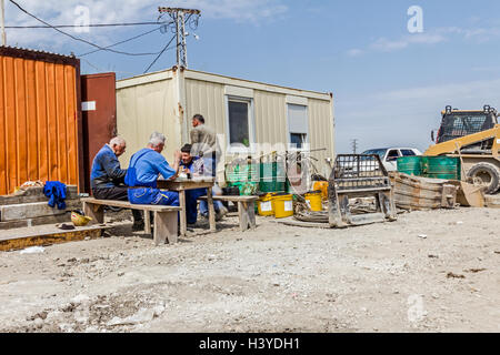 Zrenjanin, Vojvodina, Serbia - June 14, 2015: Workers are eating, break at the outdoor. Place for food time at construction site Stock Photo