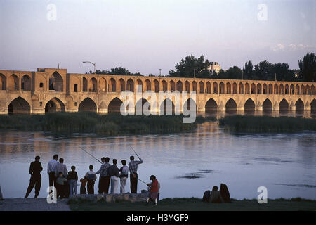 Iran, Isfahan, 33-bow bridge 'Siosehpol', river 'Zayandeh Rud', shore, angler the Middle East, front East, the Near East, Esfahan, town, bridge, arcades, bows, architectural style, structure, architecture, Sajende Rud, place of interest, riverside, men, l Stock Photo