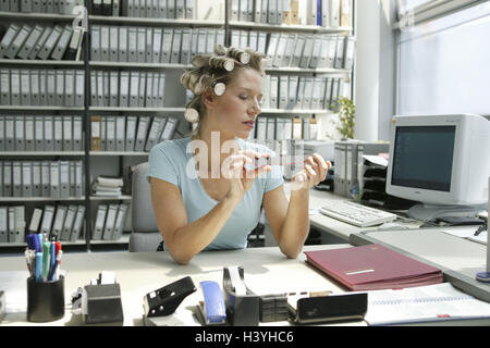 Clerks, desk, curler, nail file, office, workplace, office, authority, woman, office workers, secretary, 30-40 years, break, work break, nail care, manicure, fingernails polish, hair care, boredom, working morale, morality, prejudice, stereotype, Work-shy, inside Stock Photo