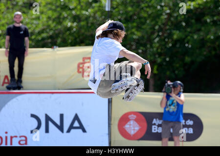 BARCELONA - JUN 28: A professional skater at the Inline skating jumps competition at LKXA Extreme Sports Barcelona Games. Stock Photo