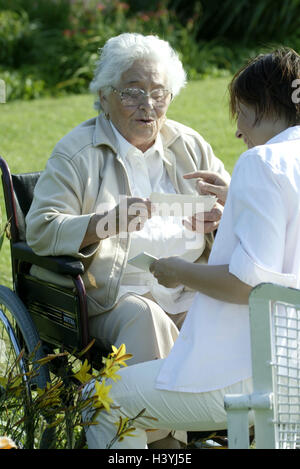 Senior, invalid, wheel chair, old nurse, photos, show old people's home, old people's home, senior citizen's home, garden, park, woman, old, old person, pensioner, pensioner, happy, smile, joy, nurse, pictures, family pictures, consider, look, entertainme Stock Photo