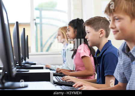 Male Elementary Pupil In Computer Class Stock Photo