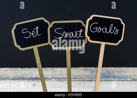 Business message Set Smart Goals written with chalk on wooden mini blackboard labels Stock Photo